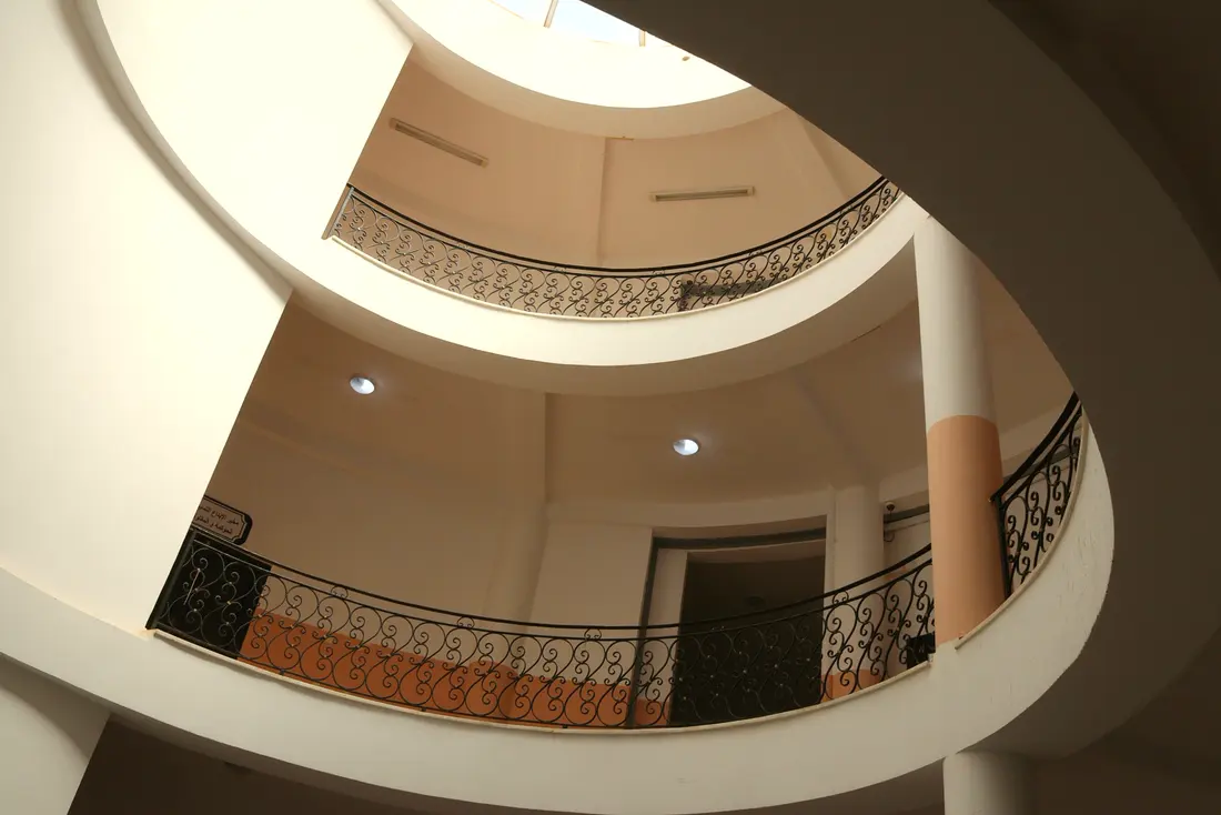 Circular galleries of the atrium, lined with wrought-iron railings