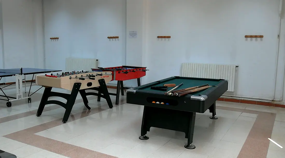 Games room with a pool table, table football and a table tennis table