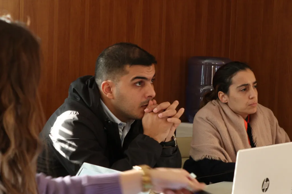 Participants listening during an information session at the incubator